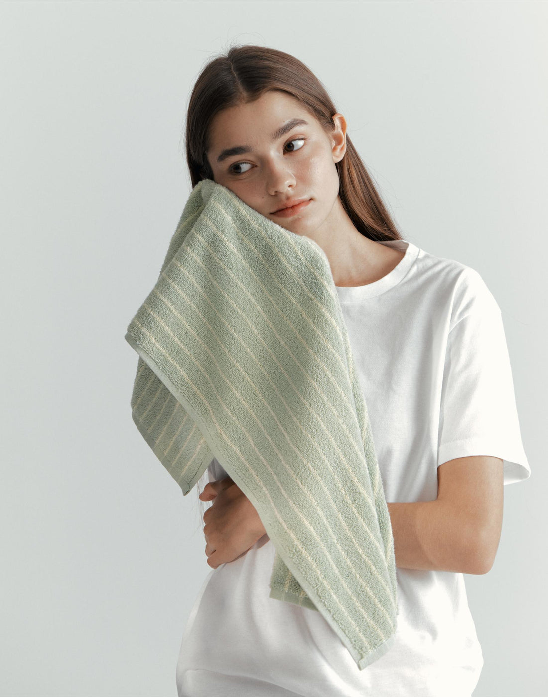 Here is a woman enjoying her korean gift which is a face towel from korean towel company Thegrann